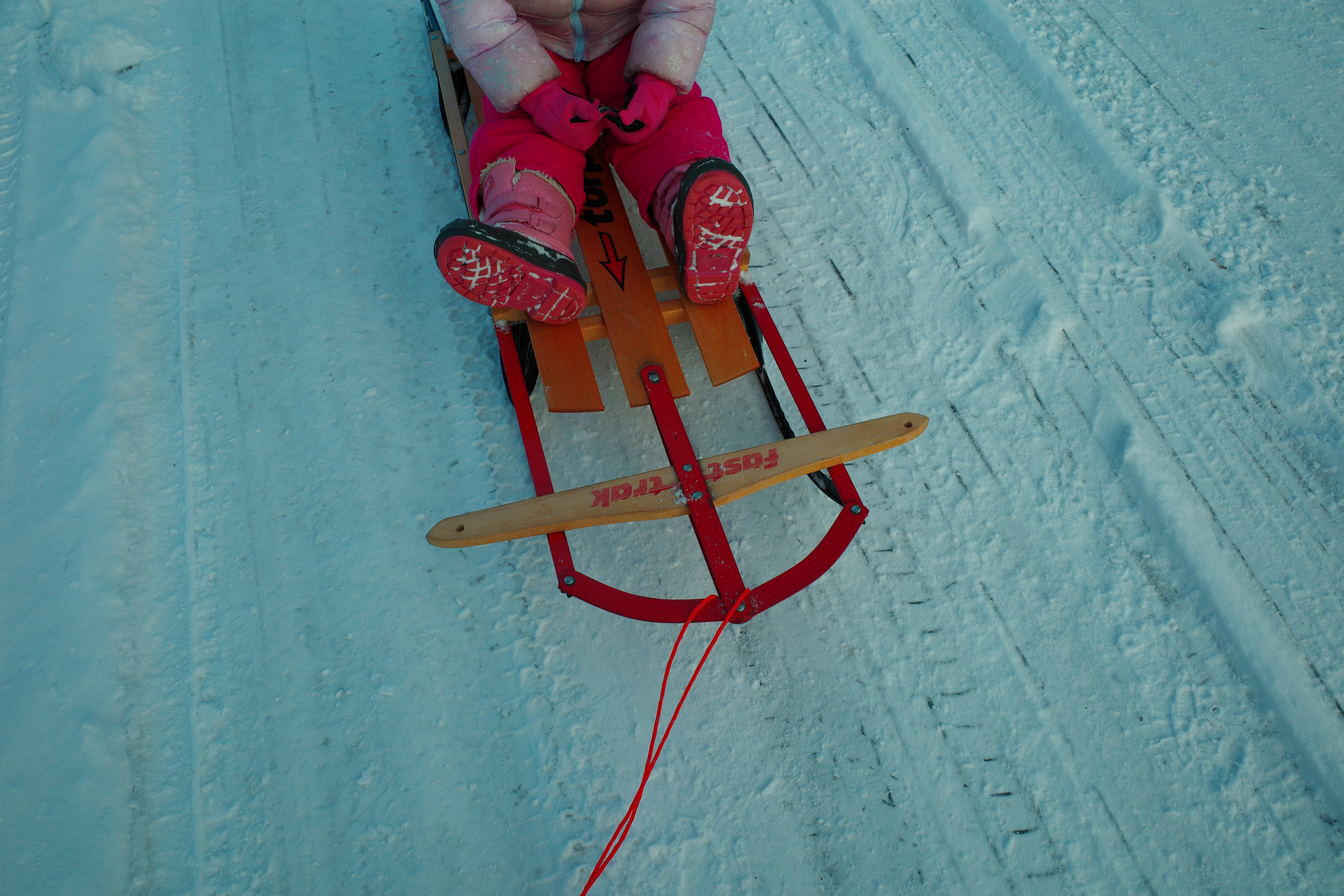 Child on sled in snow